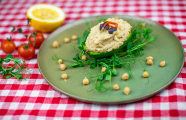 Avocado boats stuffed with hummus