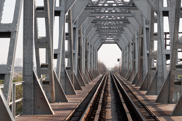 silver bridge and railway at sunrise