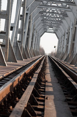 silver bridge and railway at sunrise, vertical view