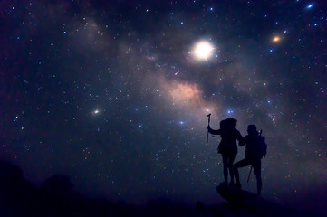 Landscape with Milky Way. Night sky with stars and silhouette of a couples happy .