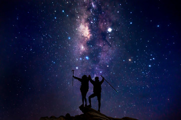 Fototapeta na wymiar Landscape with Milky Way. Night sky with stars and silhouette of a couples
