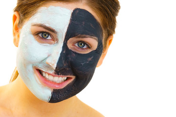 Girl with black white mud mask on face