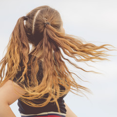 Woman having windblown ponytails