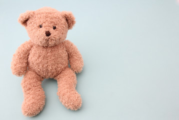 Teddy bear with blue background.