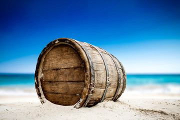 Wooden barrel on beach and free space for your decoration. 