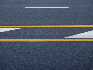asphalt road with yellow line texture