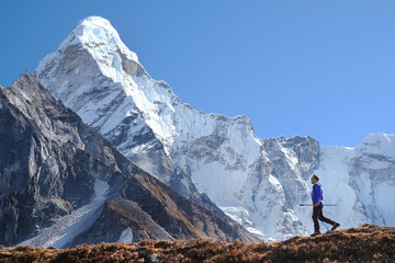 Fototapeta na wymiar Hiking in Himalaya mountains. Man Traveler backpacker hiking in the Mountains. mountaineering sport lifestyle concept