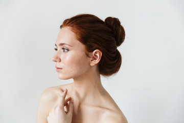 Beauty portrait of an attractive young topless redhead woman
