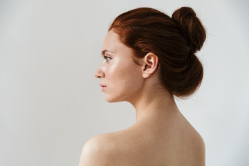 Beauty portrait of an attractive young topless redhead woman