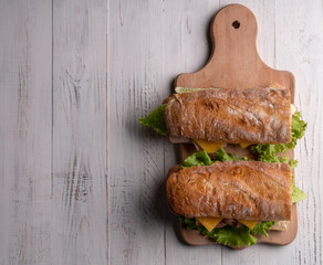 Homemade breakfast. Traditional morning food. Lunch. Delicious fresh sandwich, baguette, toast with...