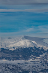 Fototapeta na wymiar Mountain peak covered in snow