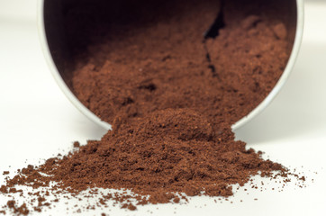 Ground coffee scattered. Morning drink. Coffee jar