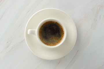 Fototapeta na wymiar Coffee cup on marble table background. Breakfast.