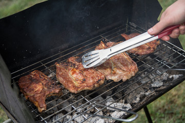 Turning the Steak on a barbeque