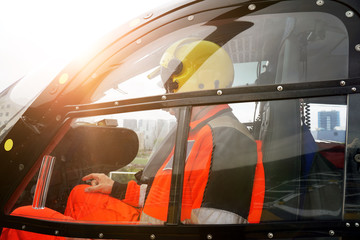 Doctor of an air ambulance as a co-pilot on board a rescue helicopter in a emergency operation