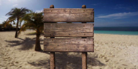 Wooden Board Sign at Sandy Beach at Tropical Island. Summer Vacation Concept