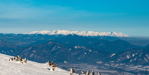 view to Zapadne and Vysoke Tatry mountains from Martinske hole in Mala Fatra mountains in Slovakia during winter