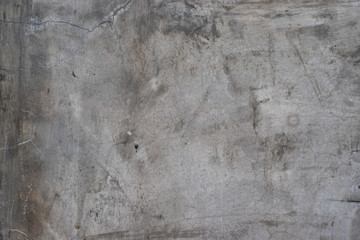 Grunge concrete wall with crack and stains in industrial building. Cement texture for design and background.