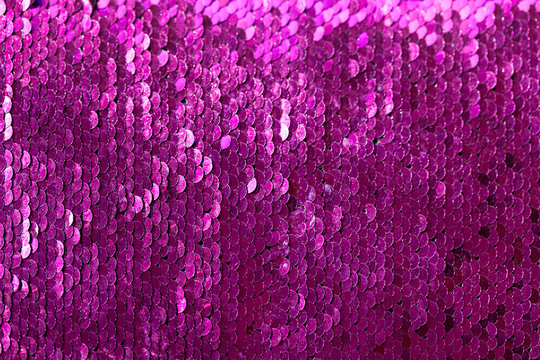 Beautiful iridescent sequins texture, fish scale fabric background, close up