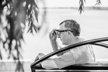 Mature European man with a sad philosophical mood. The concept of life after 50 years, problems and...