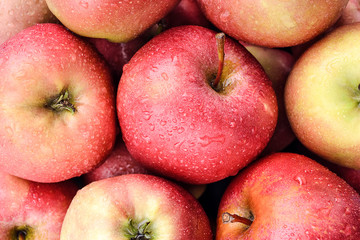 Fototapeta na wymiar red apples with drops background