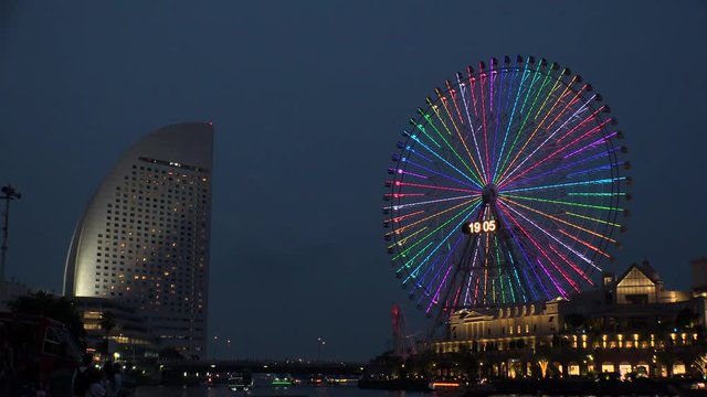 YOKOHAMA, KANAGAWA, JAPAN - 2 JUNE 2019 : Scenery of ferris wheel and sea near Minatomirai station in Yokohama city.