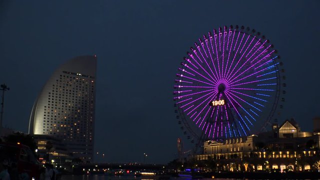 YOKOHAMA, KANAGAWA, JAPAN - 2 JUNE 2019 : Scenery of ferris wheel and sea near Minatomirai station in Yokohama city.