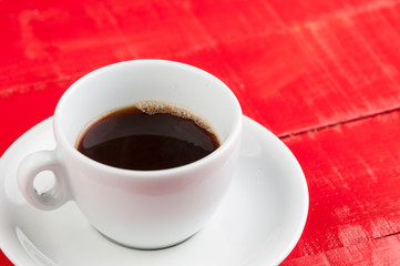 White coffee cup with  isolated on a red background.