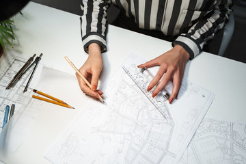 Top view of a young woman architect working