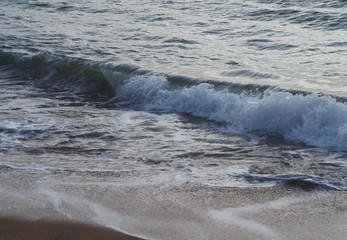 Fototapeta premium Southern tropical summer evening ocean coast at sunset. Restless sea and waves.