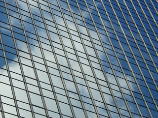 glass buiding with reflection of blue sky