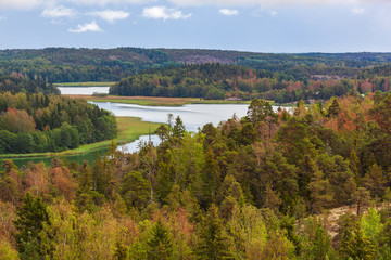 Aerial view of nature landscape with river and sea channel among the forest at Aland Islands, Finland
