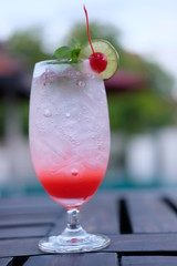 summer drink strawberry with soda at the pool