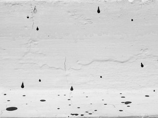 Drops of color on wall black and white style
