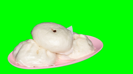 Steamed buns on a green background cup