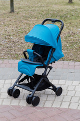 Beautiful baby carriage in the park. New design.