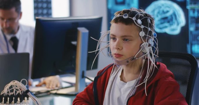 Boy undergoing electroencephalography examination