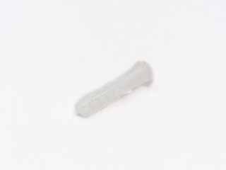 White plastic wall plug shot on white.