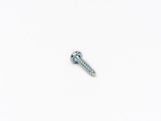 Cross recessed tapping screw, pan head shot on white.