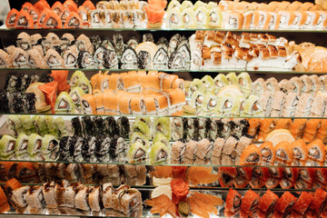 Overhead japanese sushi food. all you can eat menu. Rainbow sushi roll, uramaki, hosomaki and nigiri.