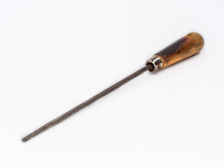 Old vintage round file with wooden handle shot on white.