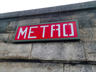 Red Metro sign on a wall