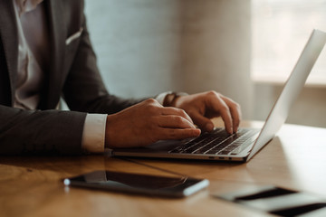 Businessman working on laptop in office