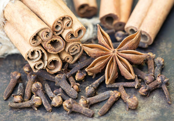 Organic healthy spices, cinnamon sticks with star anise and cloves, top view