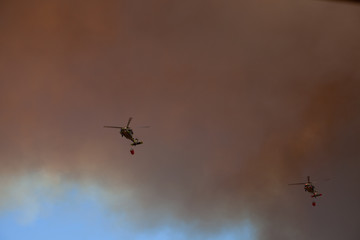 helicopter fighting wildfires in southern California