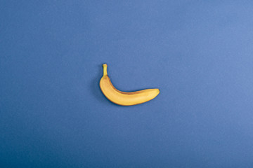 Top view of fresh and yellow banana on blue background with copy space