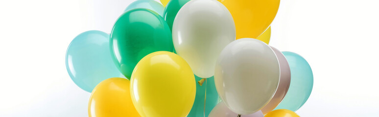 green, yellow and blue decorative balloons on white background, panoramic shot