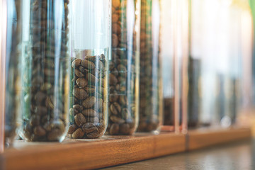 Coffee beans display in tested lab tube.