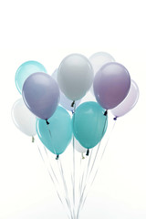 festive decorative blue, purple and white balloons isolated on white