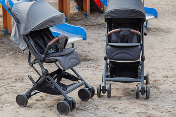 Beautiful baby carriage in the park. New design.